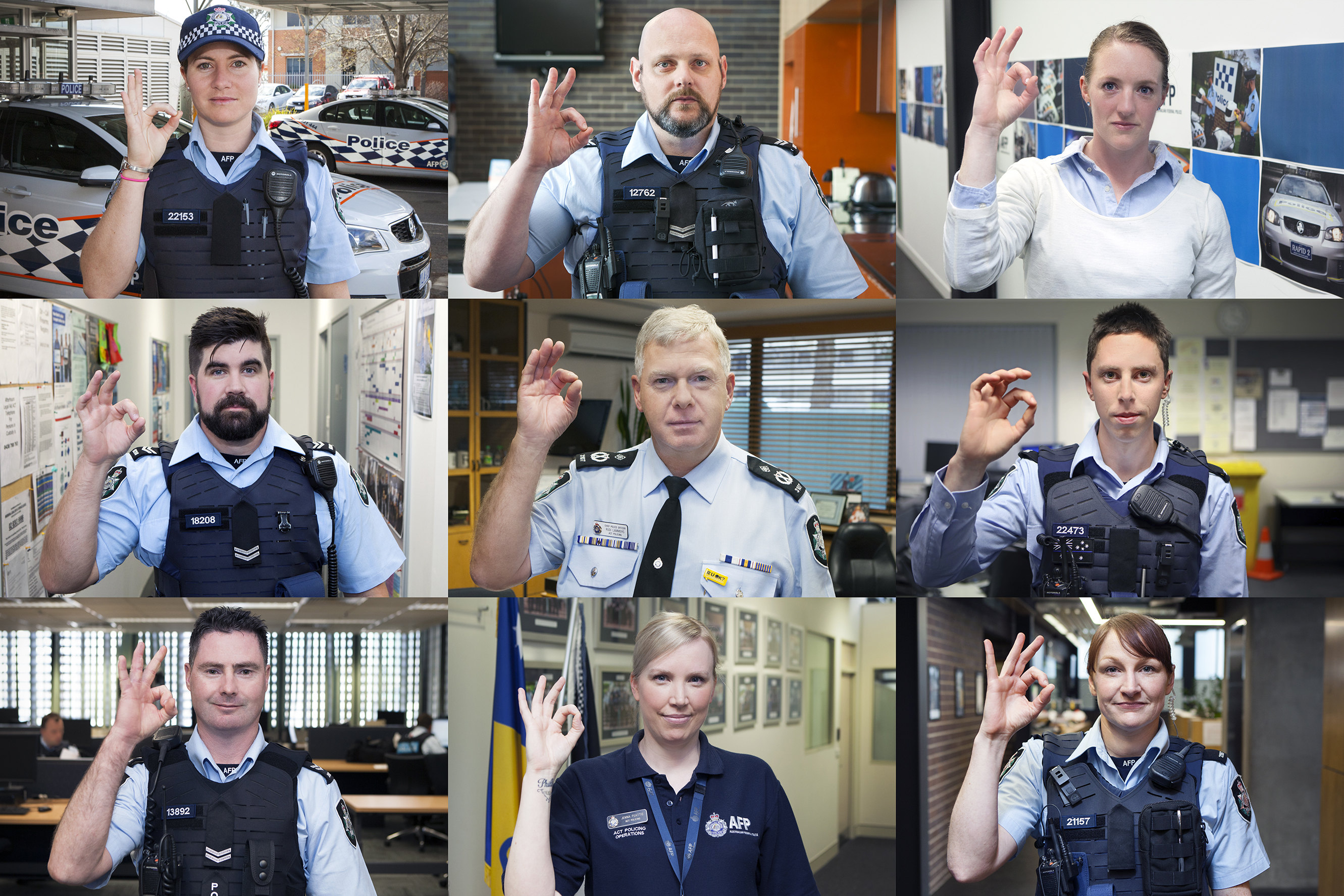Image of nine police officers making an "OK" hand signal