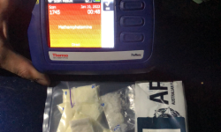 Drugs seized by police with a TruNarc reader indicating methamphetamine