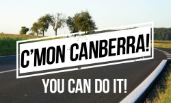 A country road scene with text overlay that reads 'C'mon Canberra, you can do it!'