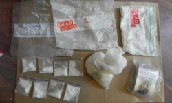 Plastic zip lock bags containing white powder & crystals believed to be drugs