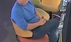 Asian man sittin in chair wearing blue long sleeve shirt at the Gungahlin Raiders Club