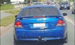 The blue Ford Falcon (pictured) had a missing rear windscreen, which appeared to be covered in black material.