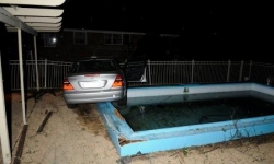 Mercedes almost crashes into pool,